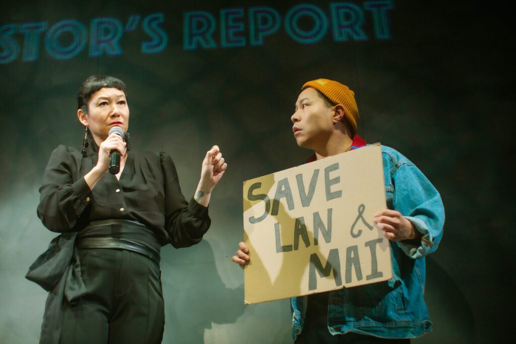 CEO Gigi (Erin Mei-Ling Stuart) leads an investor's report protested by Beau (Will Dao) 