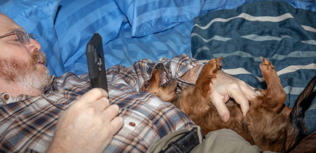 Geoffrey and a Snappy AuRoara on the Bed