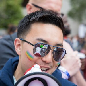 Man with a microphone leading the group chants